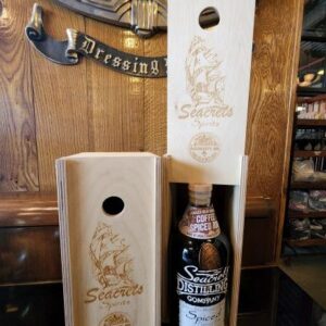 a bottle of whiskey sitting inside of a wooden box