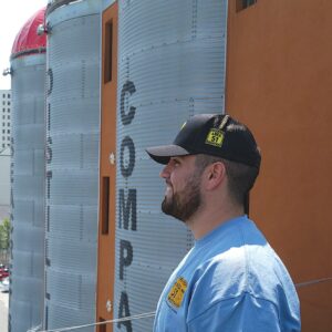 a man standing in front of a building
