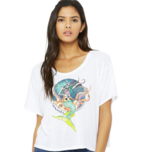 a woman wearing a white shirt and jeans