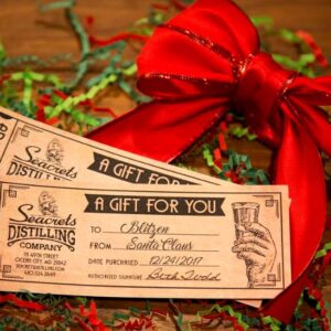 a pair of tickets sitting on top of a wooden table