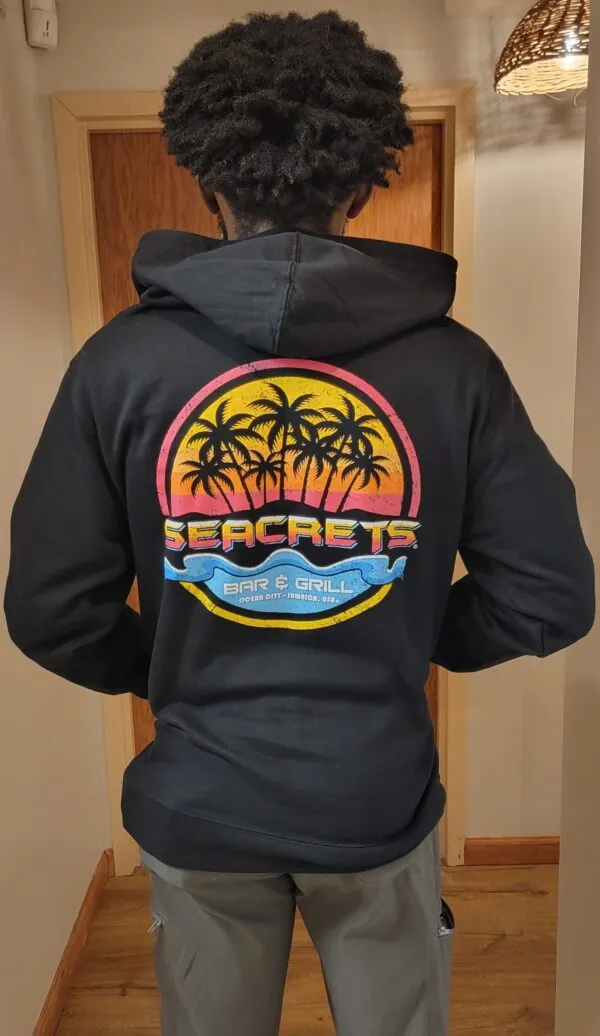the back of a person wearing a black hoodie