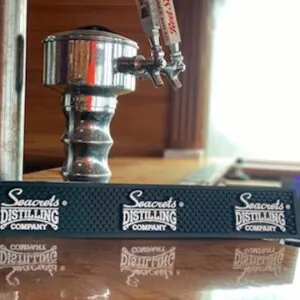a coffee grinder sitting on top of a wooden table