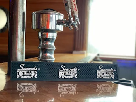 a coffee grinder sitting on top of a wooden table