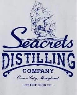 a white t - shirt with the words seacrests distilling company on