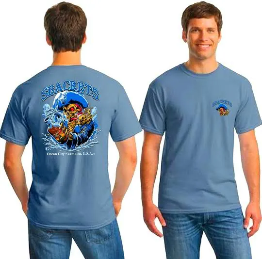 a man wearing a blue shirt with an image of a surfer on it