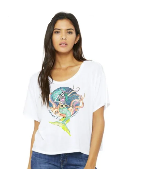 a woman wearing a white shirt and jeans