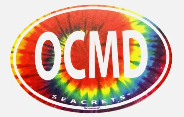 a circular sticker with the word ocmd on it